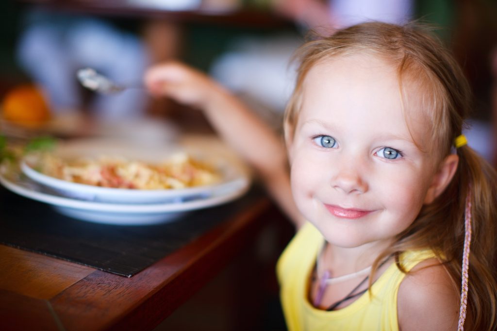 Child enjoying lunch at Holiday Inn