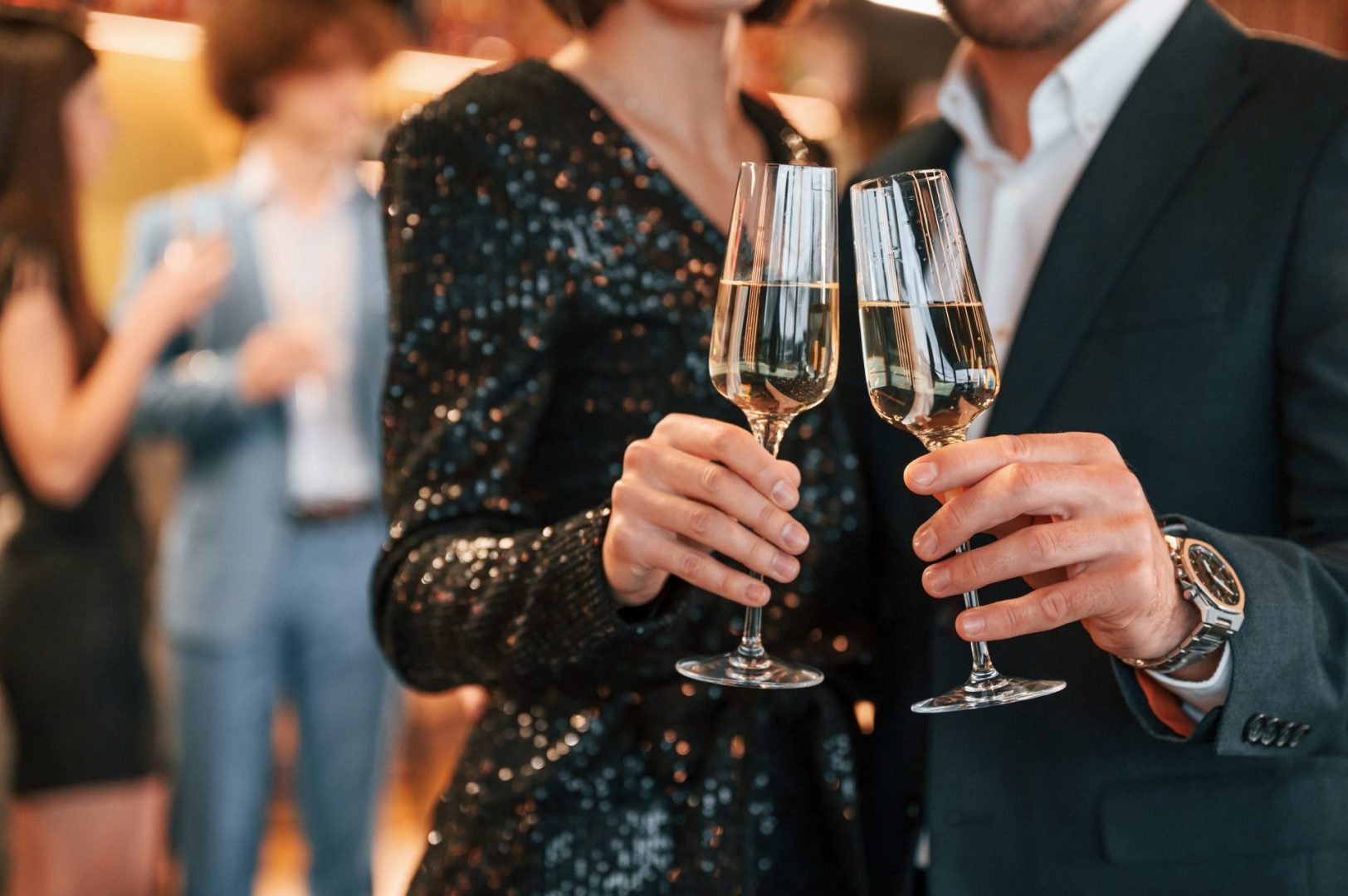 Close,Up,View,Of,Champagne,Glasses.,Group,Of,People,In