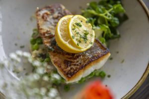 lemon slice on top of a cooked fish
